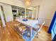 Bright dining room with hardwood floors and view into the living room at 13316 Alex Mill Dr, Pineville, NC 28134