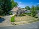 Beautiful brick home featuring a well-manicured lawn and a two-car garage at 13316 Alex Mill Dr, Pineville, NC 28134