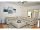Spacious living room with hardwood floors and a large sectional sofa at 13316 Alex Mill Dr, Pineville, NC 28134