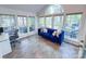 Bright sunroom with floor to ceiling windows and a comfortable seating area at 13316 Alex Mill Dr, Pineville, NC 28134