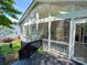 Bright sunroom with large windows and a view of the backyard at 13316 Alex Mill Dr, Pineville, NC 28134
