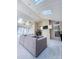 Bright sunroom with skylights, ceiling fans, neutral paint, plush carpet, and comfortable seating at 13316 Alex Mill Dr, Pineville, NC 28134