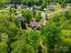 Aerial view of home and neighborhood with mature trees, and well-maintained lawns at 1374 Weatherby Dr, Salisbury, NC 28146
