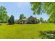 Expansive backyard with lush green lawn, mature trees, and plenty of space for outdoor activities at 1374 Weatherby Dr, Salisbury, NC 28146