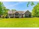 Expansive backyard featuring a deck and ample lawn space, perfect for outdoor activities and entertaining at 1374 Weatherby Dr, Salisbury, NC 28146