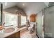 Well-lit bathroom features a walk-in shower, modern toilet, and a classic design at 1374 Weatherby Dr, Salisbury, NC 28146