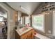 Well-lit bathroom features marble countertops, classic fixtures, and a cozy ambiance at 1374 Weatherby Dr, Salisbury, NC 28146