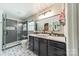 Updated bathroom with stylish vanity, modern shower, and decorative tile flooring at 1374 Weatherby Dr, Salisbury, NC 28146