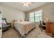Cozy bedroom with a double bed, window, desk, and a comfortable chair at 1374 Weatherby Dr, Salisbury, NC 28146