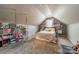 Cozy bedroom features unique hanging chair and sloped ceilings, creating a charming, inviting space at 1374 Weatherby Dr, Salisbury, NC 28146