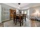 Cozy dining area with hardwood floors, a decorative hutch, and natural light from nearby windows at 1374 Weatherby Dr, Salisbury, NC 28146