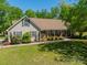 Beautiful home with a welcoming front porch, well-manicured lawn and mature landscaping at 1374 Weatherby Dr, Salisbury, NC 28146