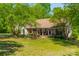 Charming home with a welcoming front porch, well-manicured lawn and mature landscaping at 1374 Weatherby Dr, Salisbury, NC 28146