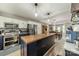 Modern kitchen featuring stainless appliances, an island, and an open view to the dining area at 1374 Weatherby Dr, Salisbury, NC 28146