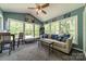 Bright sunroom with large windows offering ample natural light and views of the outdoors at 1374 Weatherby Dr, Salisbury, NC 28146