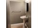 Bathroom featuring a pedestal sink, natural lighting, and neutral walls at 14131 Lucia Riverbend Hwy, Mount Holly, NC 28120
