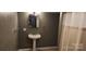Small bathroom featuring a classic pedestal sink and neutral color scheme at 14131 Lucia Riverbend Hwy, Mount Holly, NC 28120