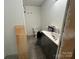 Bathroom undergoing remodeling with new vanity, fixtures, tile floors and a new toilet at 14131 Lucia Riverbend Hwy, Mount Holly, NC 28120