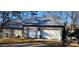 The property features a large, detached garage with two garage doors and rustic decor at 14131 Lucia Riverbend Hwy, Mount Holly, NC 28120