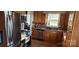 Kitchen featuring stainless steel appliances, wood cabinets, tile backsplash and wood floors at 14131 Lucia Riverbend Hwy, Mount Holly, NC 28120