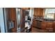 Kitchen featuring stainless steel appliances, wood cabinets, tile backsplash and wood floors at 14131 Lucia Riverbend Hwy, Mount Holly, NC 28120