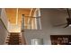 Bright staircase featuring white railings and wood ceiling at 14131 Lucia Riverbend Hwy, Mount Holly, NC 28120