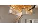 Bright and airy staircase featuring white railings and natural light at 14131 Lucia Riverbend Hwy, Mount Holly, NC 28120