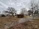 View of expansive yard featuring mature trees, shrubs, and bare lawn at 14131 Lucia Riverbend Hwy, Mount Holly, NC 28120