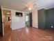 Bedroom with adjacent bathrooms, hard floors, and mounted television at 143 Ezra Rd, Kings Mountain, NC 28086