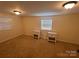 Cozy bedroom with neutral carpet, natural light, and matching bedside tables at 143 Ezra Rd, Kings Mountain, NC 28086