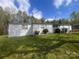 Well maintained manufactured home on a grassy lot with mature trees at 143 Ezra Rd, Kings Mountain, NC 28086