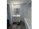 Updated bathroom featuring a sleek vanity with drawers and a clean bathtub shower combination at 155 Ervin Loop, China Grove, NC 28023