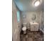 Well-lit bathroom featuring a single vanity, toilet, and neutral colors, highlighted by natural light at 155 Ervin Loop, China Grove, NC 28023