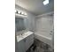 Bathroom featuring a large vanity with drawers and a bathtub shower combination with gray flooring at 155 Ervin Loop, China Grove, NC 28023