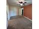 Spacious bedroom with carpet, ceiling fan, and an open doorway, illuminated by natural light at 155 Ervin Loop, China Grove, NC 28023