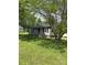 Cozy home with a charming front porch surrounded by lush greenery at 155 Ervin Loop, China Grove, NC 28023