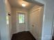 Hallway with closet, coat hooks and a door leading to the back yard at 155 Ervin Loop, China Grove, NC 28023