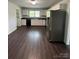 Modern kitchen with white cabinets, stainless steel appliances and dark countertops at 155 Ervin Loop, China Grove, NC 28023