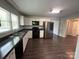 Updated kitchen features white cabinetry, modern appliances, and dark countertops at 155 Ervin Loop, China Grove, NC 28023