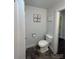 Small bathroom with a toilet and sink, offering efficient use of space and basic amenities at 155 Ervin Loop, China Grove, NC 28023