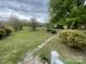 Expansive backyard featuring a lush lawn, mature trees, a gazebo, and well-maintained landscaping at 1620 Moss Springs Rd, Albemarle, NC 28001