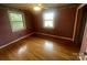 Bedroom with hardwood floors, original window and closet at 1620 Moss Springs Rd, Albemarle, NC 28001