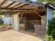 Attached carport featuring a concrete floor, wood frame, and ample storage space in an outdoor storage area at 1620 Moss Springs Rd, Albemarle, NC 28001