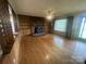 Spacious living room with hardwood floors, fireplace and built-in shelves at 1620 Moss Springs Rd, Albemarle, NC 28001