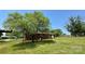 Back view of a brick house with a lawn and trees at 1684 Montevista Dr, Shelby, NC 28150