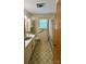 Functional bathroom featuring a tub-shower combo, vanity, and patterned flooring at 1684 Montevista Dr, Shelby, NC 28150