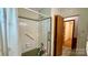 Bathroom area featuring a shower and a door to another room at 1684 Montevista Dr, Shelby, NC 28150