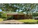 Charming brick home featuring a covered parking area and well-maintained front lawn at 1684 Montevista Dr, Shelby, NC 28150