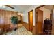Hallway with wood-paneled accents and a patterned floor leading to various rooms at 1684 Montevista Dr, Shelby, NC 28150