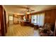 Open kitchen and living area with wood paneled walls and vintage flooring at 1684 Montevista Dr, Shelby, NC 28150